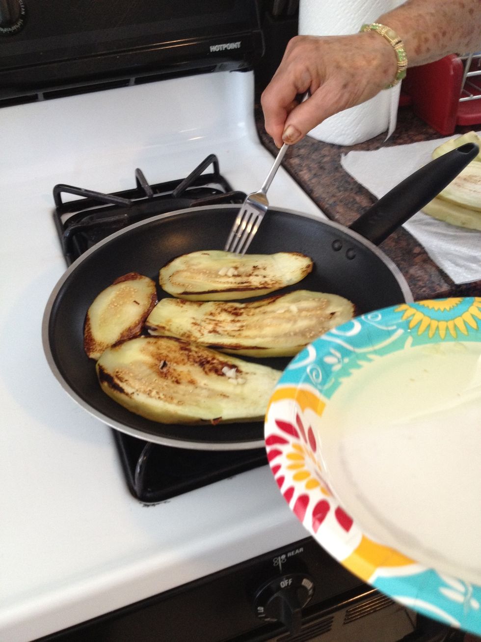 Take a bit of the garlic oil and put on the roasted side of the eggplant