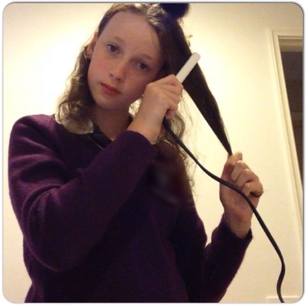 Take a bit of your hair and put it in the middle of the straightener and push the ends of the straightener together and slowly pull it down