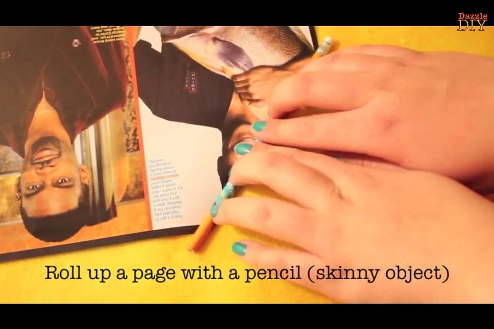 Take a blad paper of a magazine and roll up a page with a pencil.  Then cut the ends of.