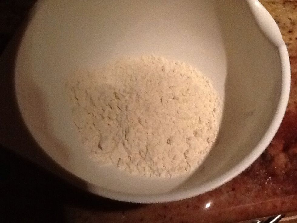 Take a bowl and pour the flour into it
