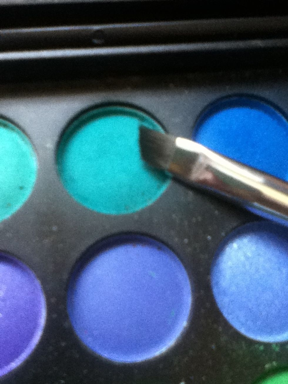 Take a bright turquise/blue and a small angled eye brush. (colour looks brighter in person)