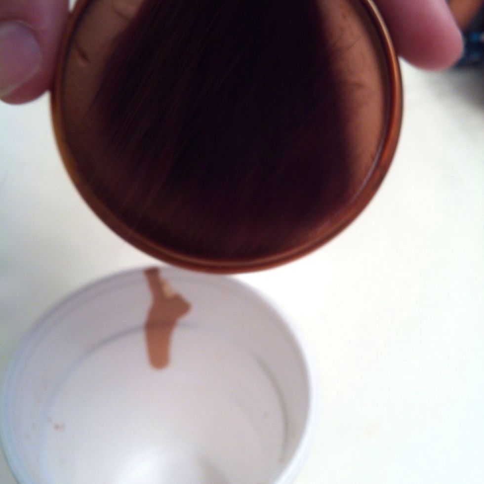 Take a brush and get some bronzer out without making a hole in your bronzer. So lightly sweep it and it should fall right out