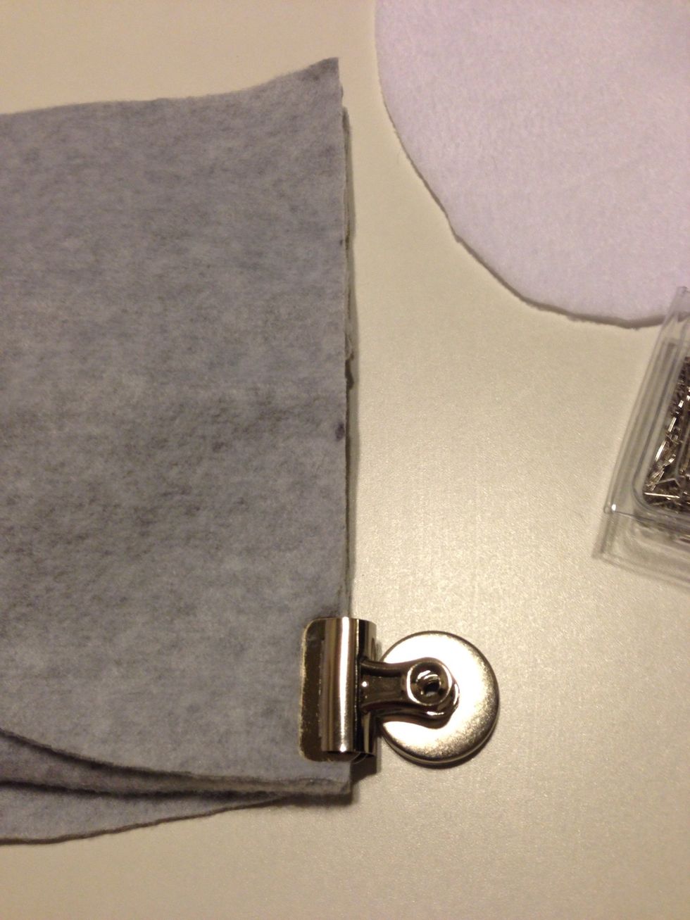 Take a clamp or needle and start holding ur line in place for sewing.