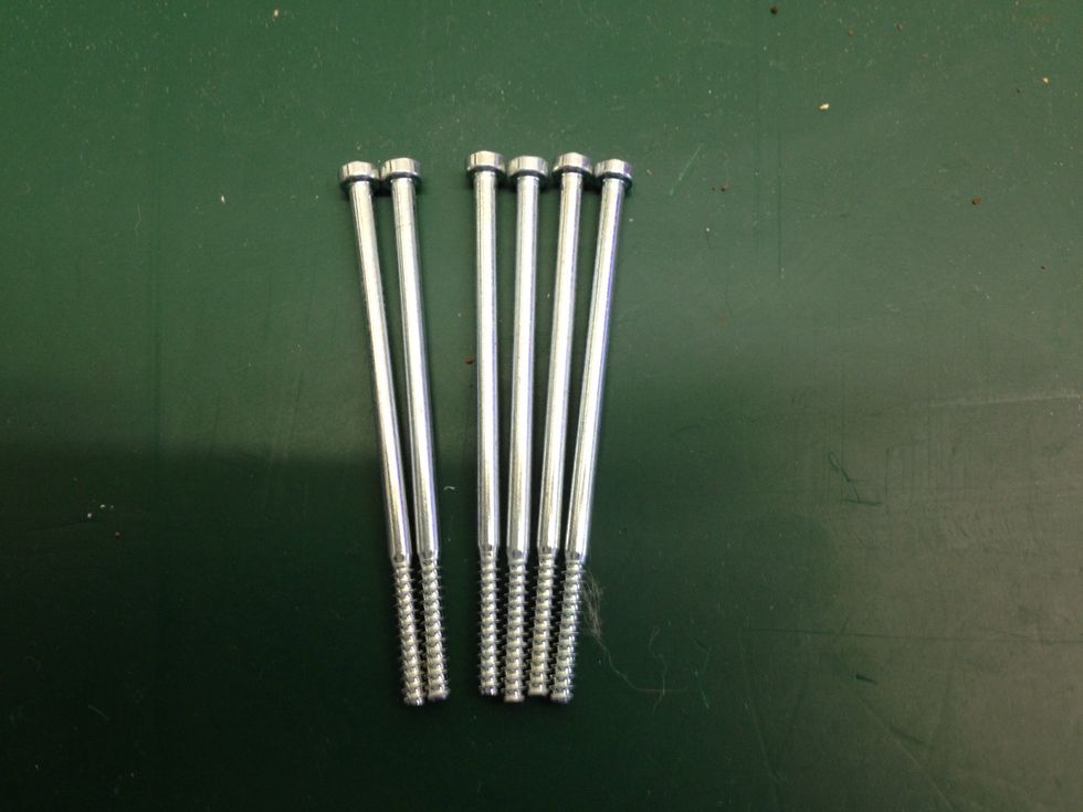 Take a close look at the heads, if your screws do not match up, put them back and unscrew the right ones!