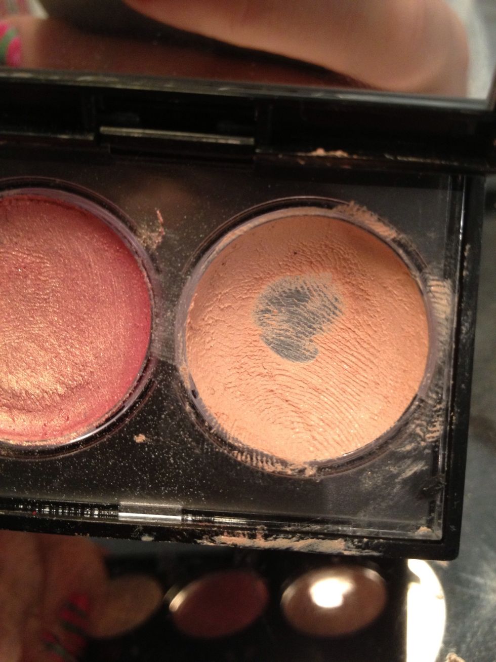 Take a cream eyeshadow the same shade as your skin. Apply to lid to even out canvas, and create a tacky base.