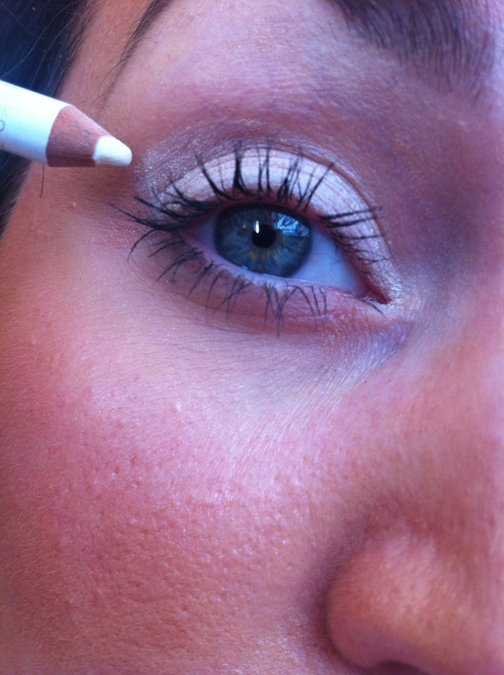 Take a creamy white eyeliner pencil & apply to the whole eyelid then smudge and blend with your finger. This acts as a great sticky base!