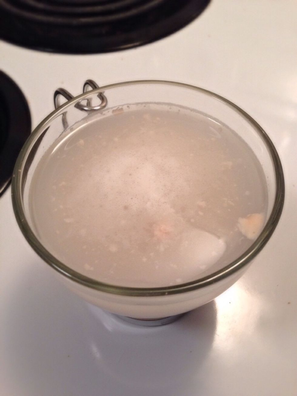 Take a cup of warm water, add a pinch of sugar and crumble 60g (2oz) of yeast in it. The yeast is ready when it starts floating on the surface.