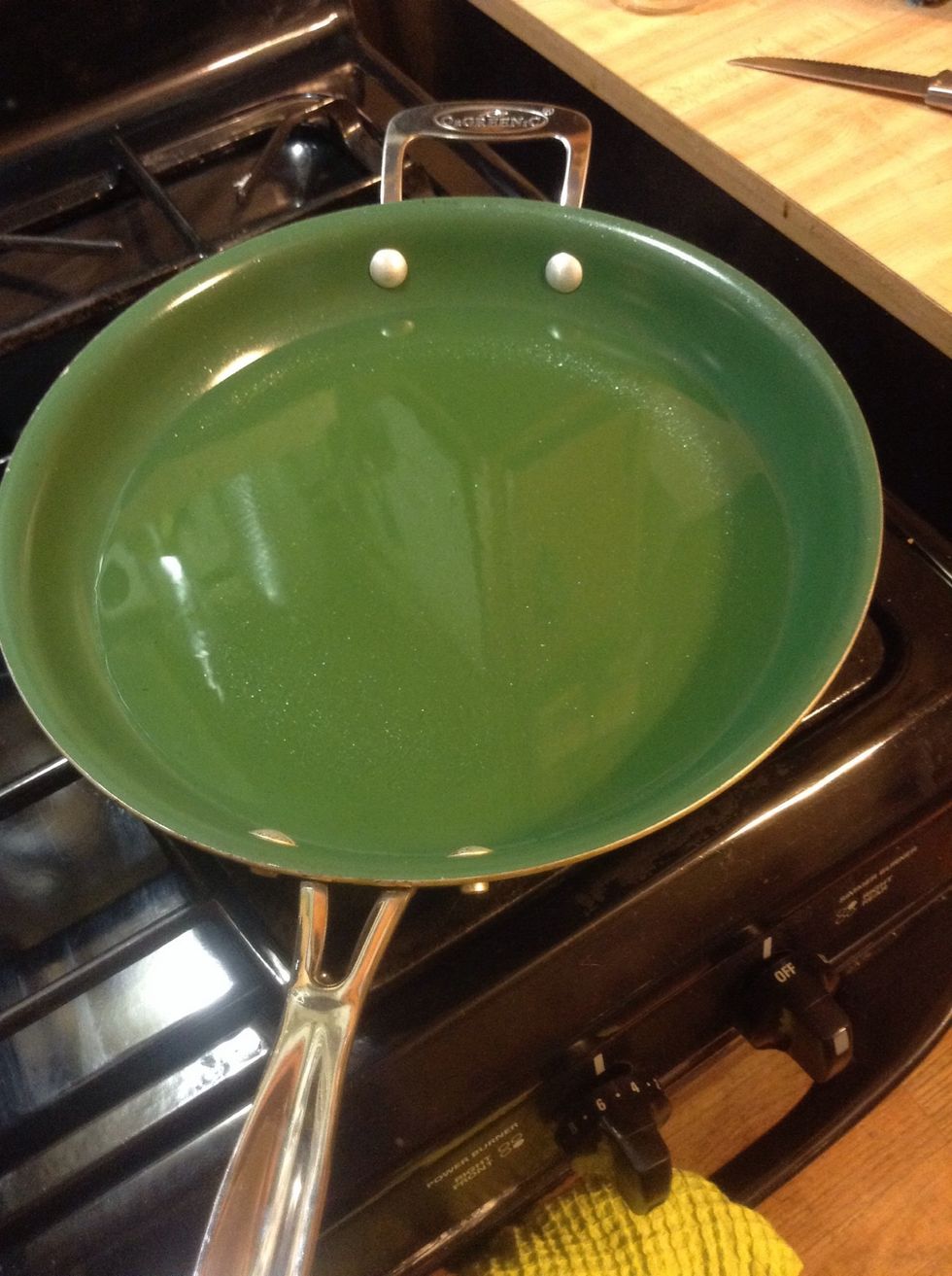 Take a deep frying pan and pour olive oil to about an inch in depth. I am trying to be healthy by using olive oil but you can use what you wish! I have it set on about medium heat.