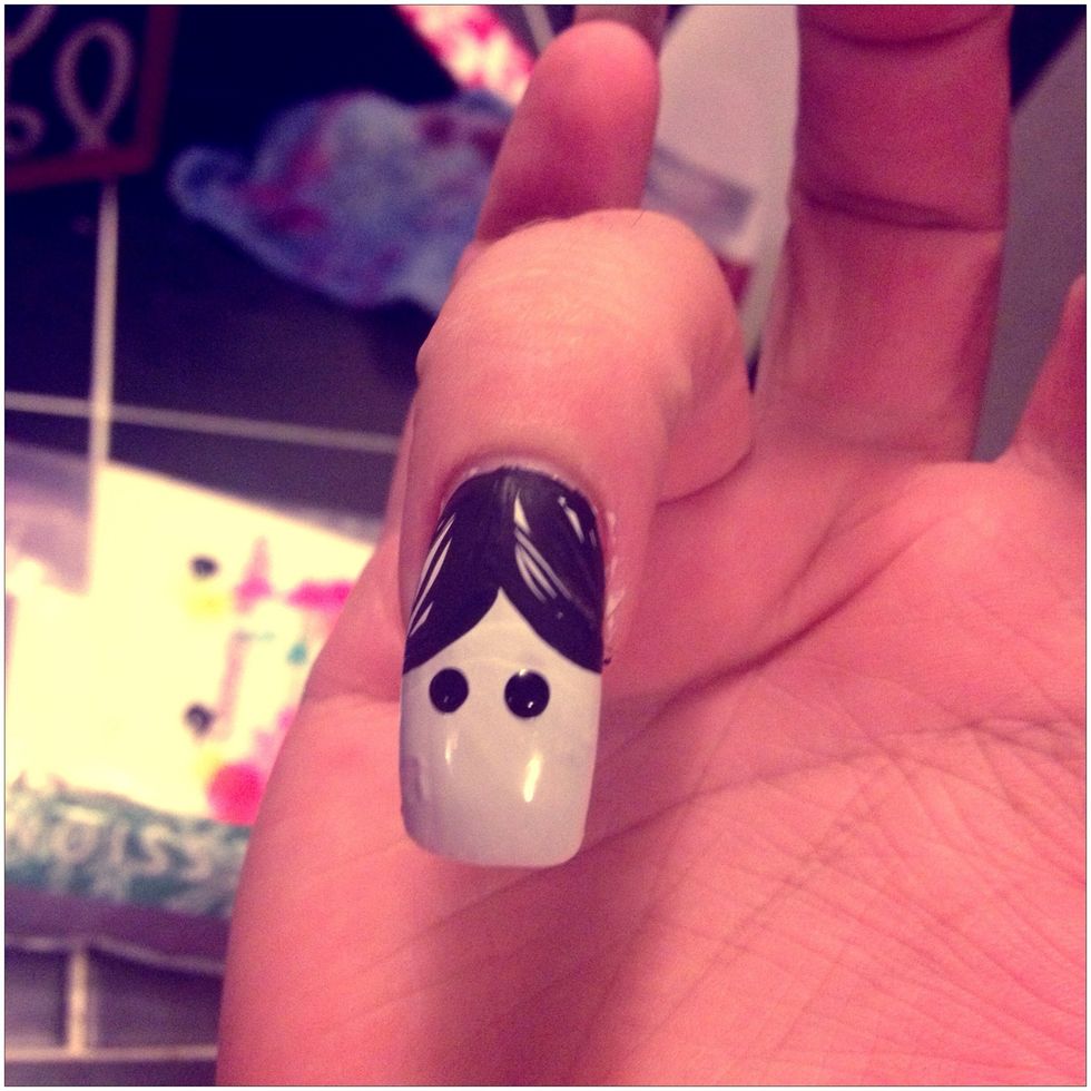Take a dotting tool, and create her eyes