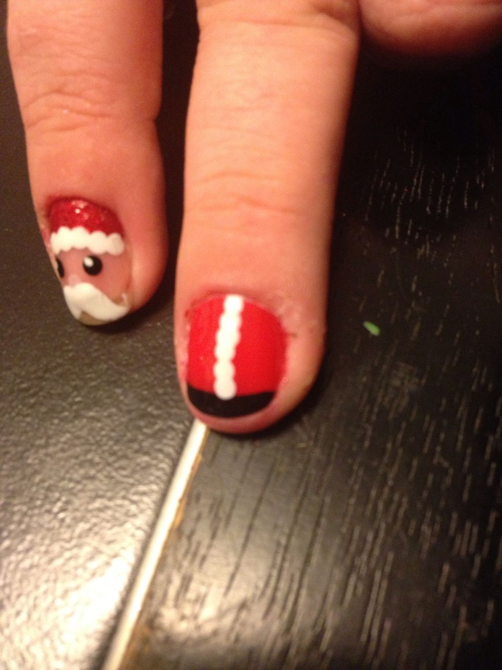 Take a dotting tool or toothpick and dot the center right of the nail