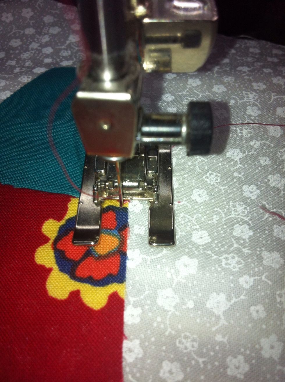 Take a few stitches in place with a Zero Stitch Length to secure. Then set the length back to One.