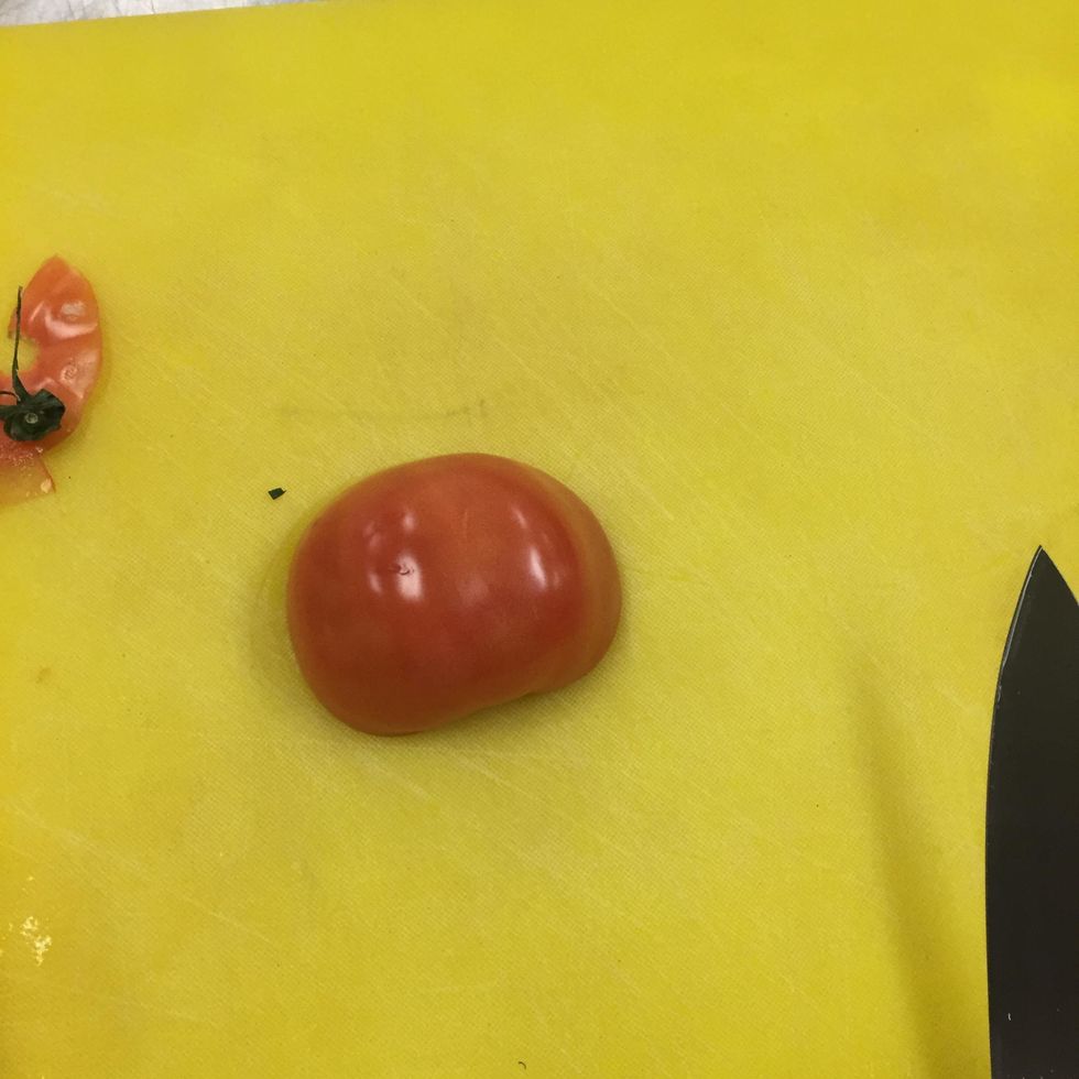 take a firm tomato and cut in half