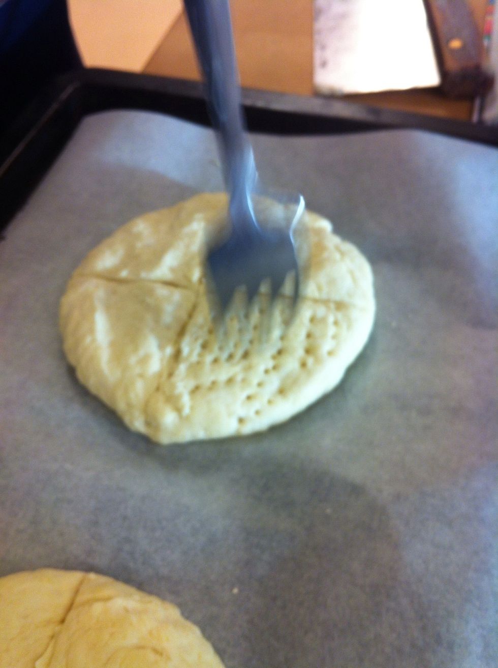 take a fork and make tiny holes. Into the preheated oven at 350 degrees celsius
