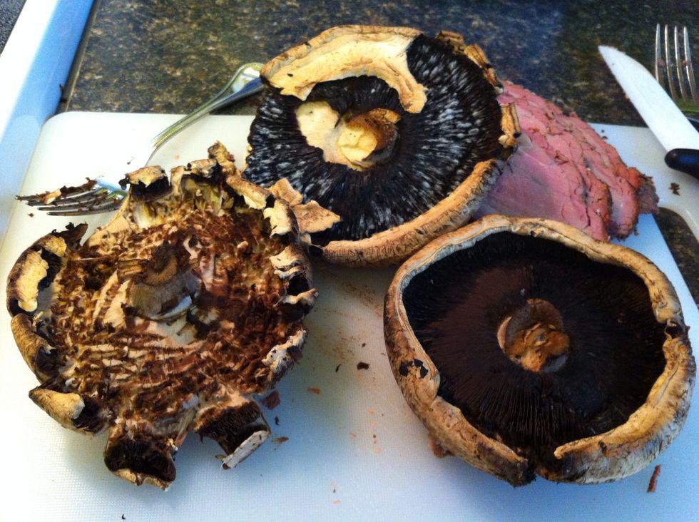 Take a fork or spoon and remove the black insides of the mushrooms.