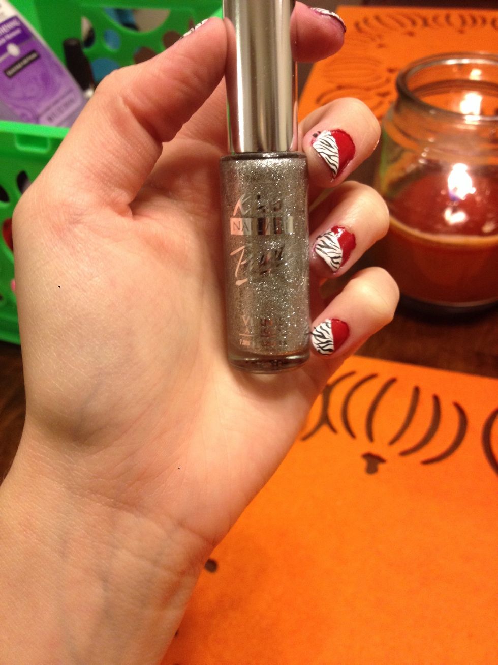 Take a glitter and thin nail art brush :)