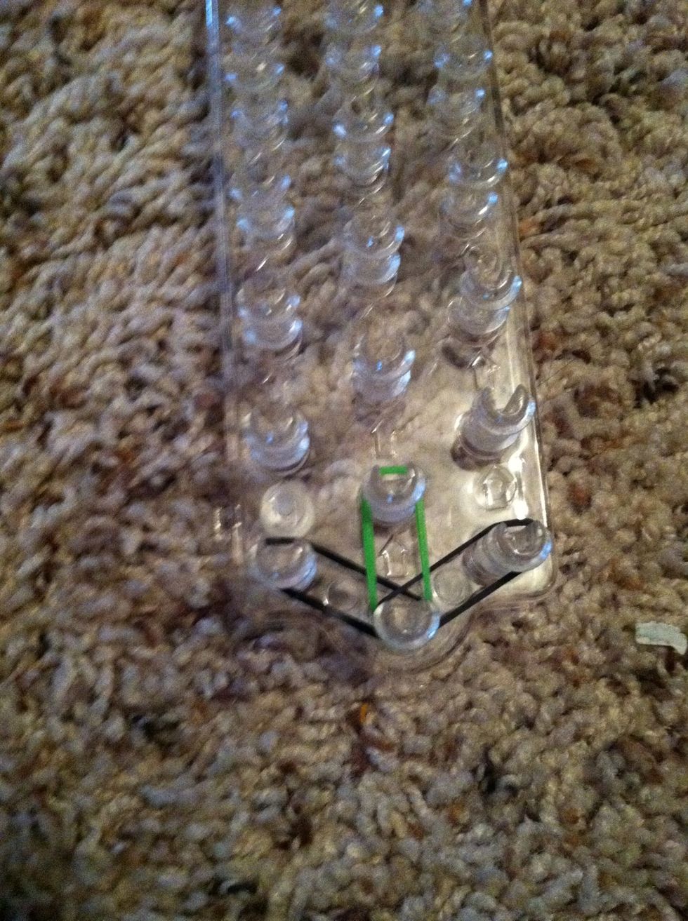 Take a green and put it on the middle row.