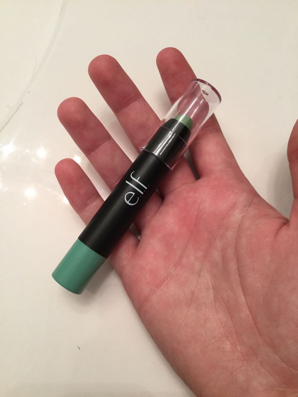 Take a green concealer or color corrector and apply that to any red areas.