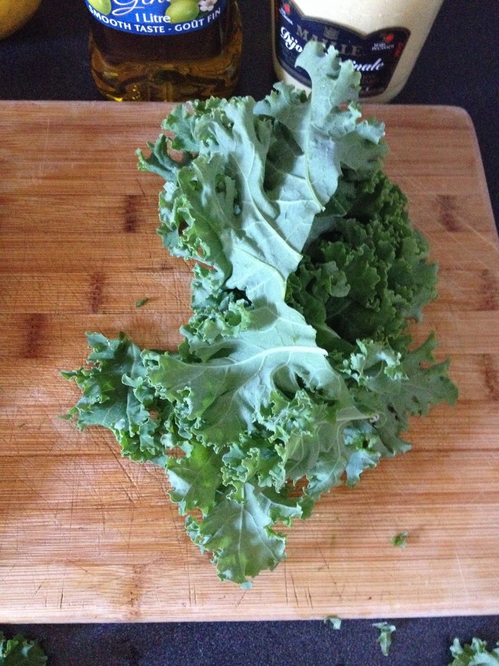 Take a handful of trimmed kale leaves and stack them loosely.