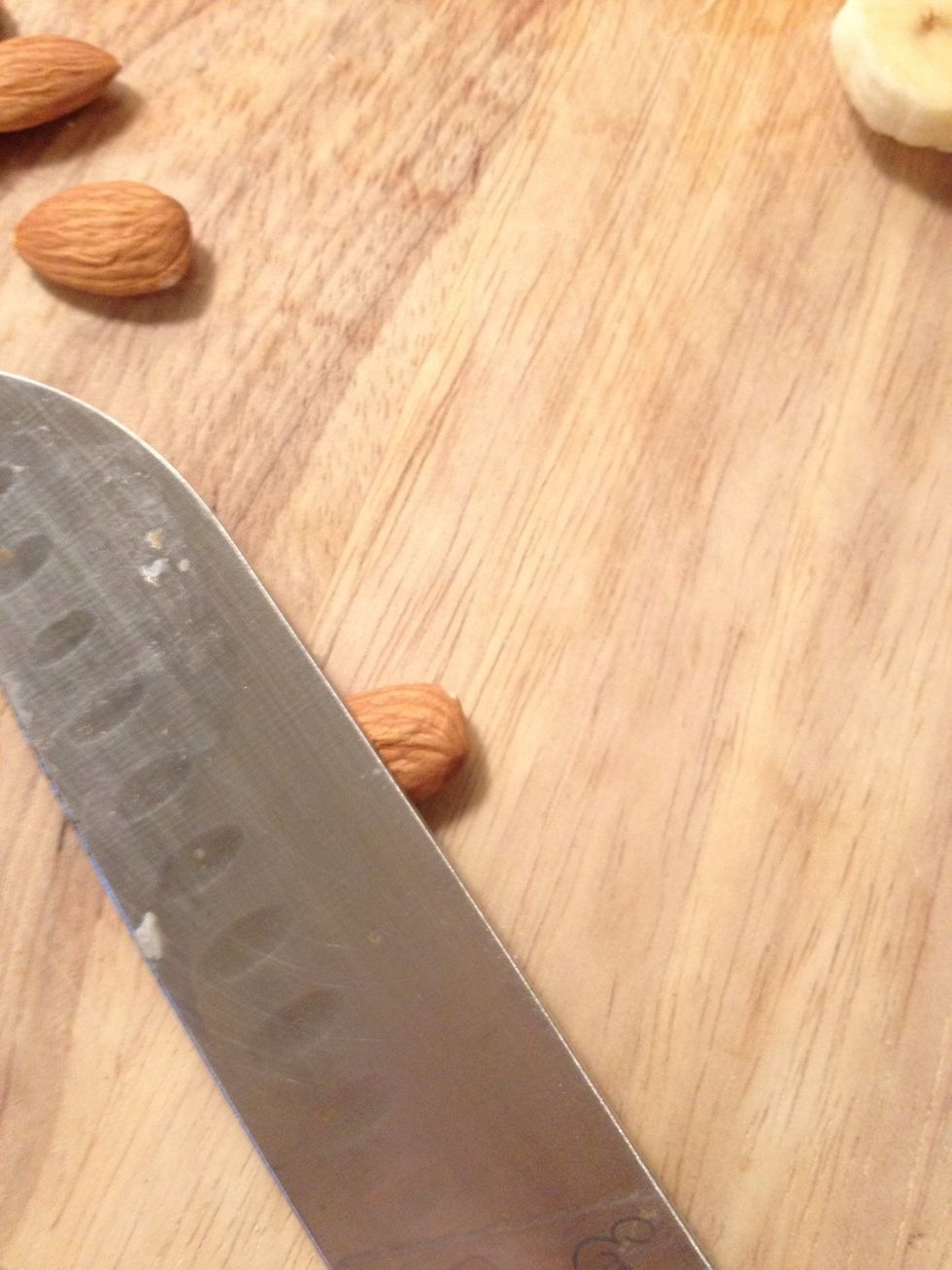 Take a knife and place over an almond
