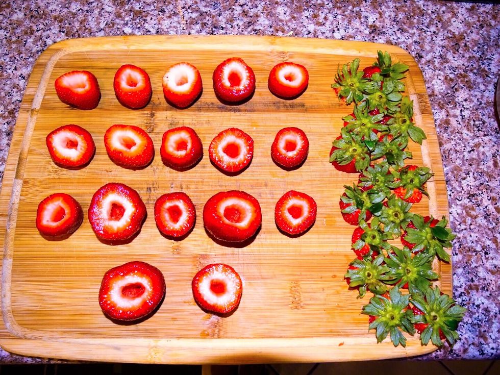 Take a knife to cut off the tops and cut around the middle, making room for squeezing in the cheesecake. \ud83d\ude0b
