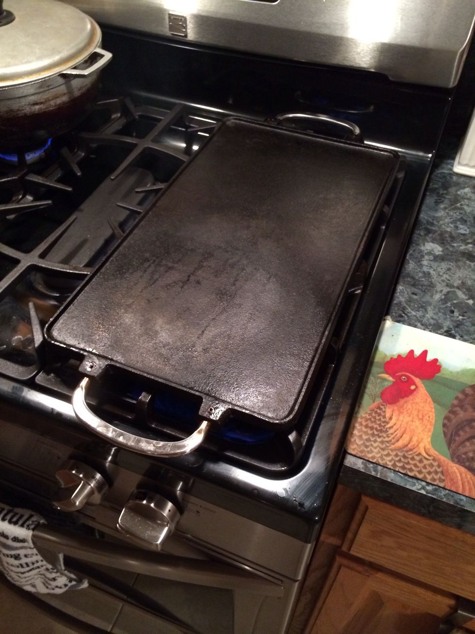 Take a large griddle, hopefully cast iron. Get it real hot, I mean smoking hot.