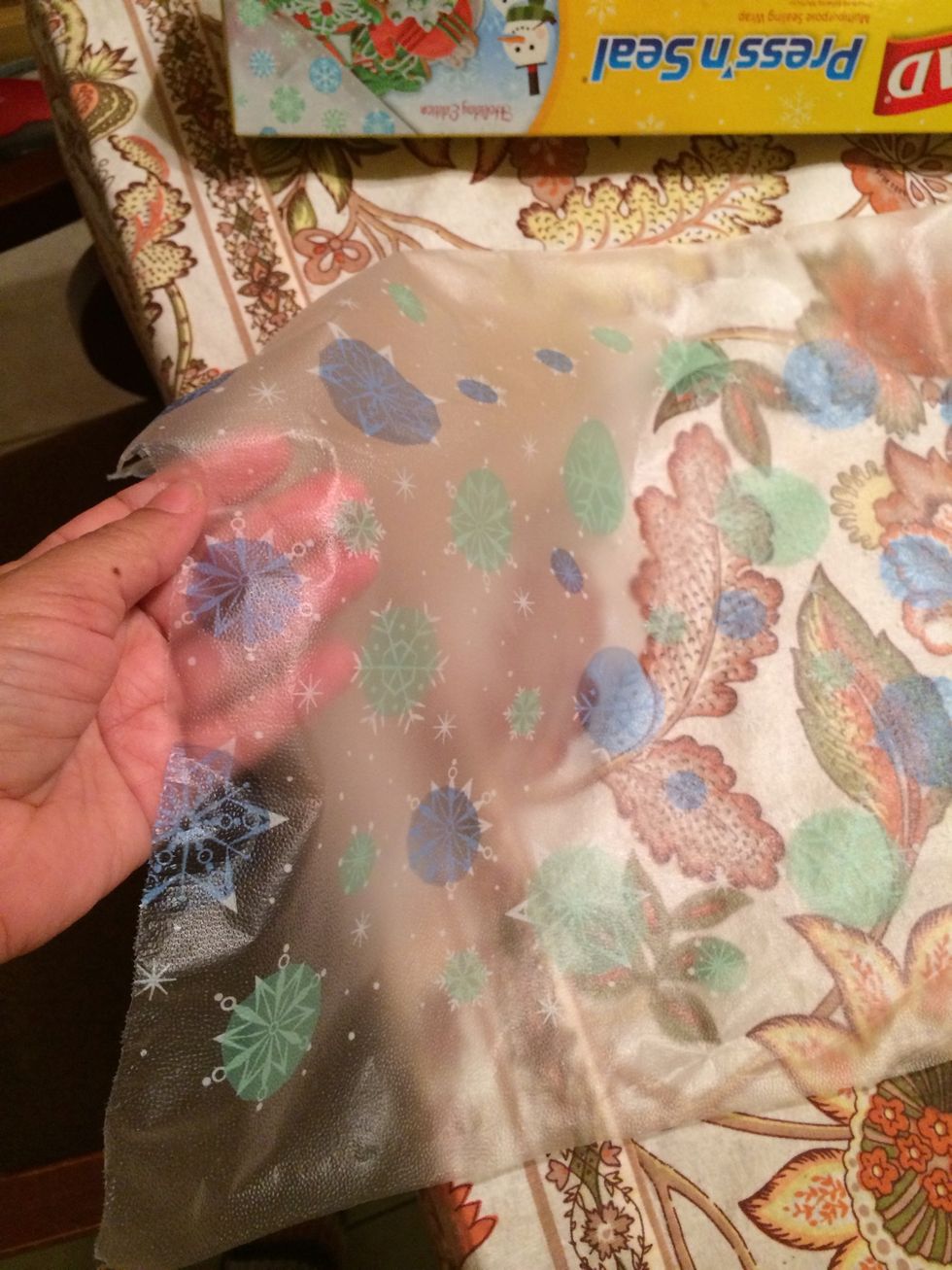 Take a large piece of saran wrap