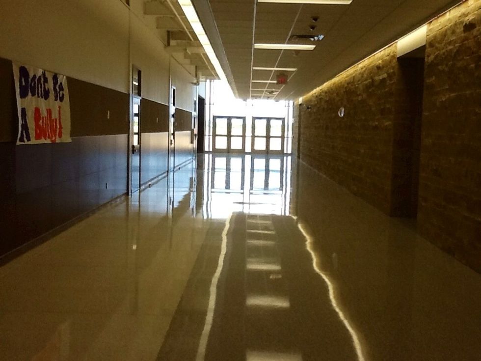 Take a LEFT at the end of the hallway and WALK to the double doors.