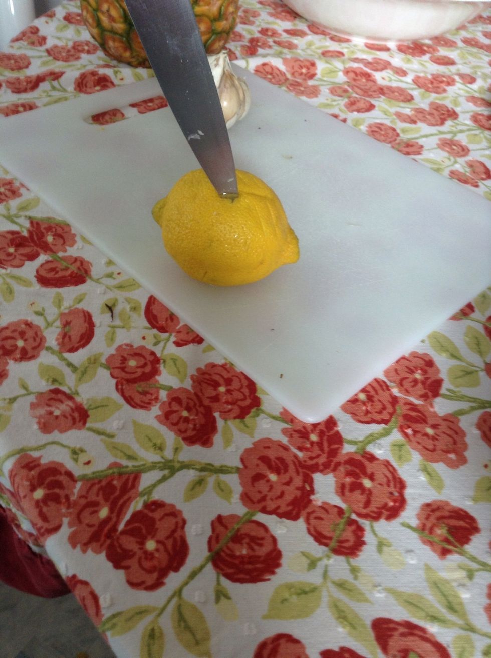 Take a lemon and poke holes in it all over its surface.