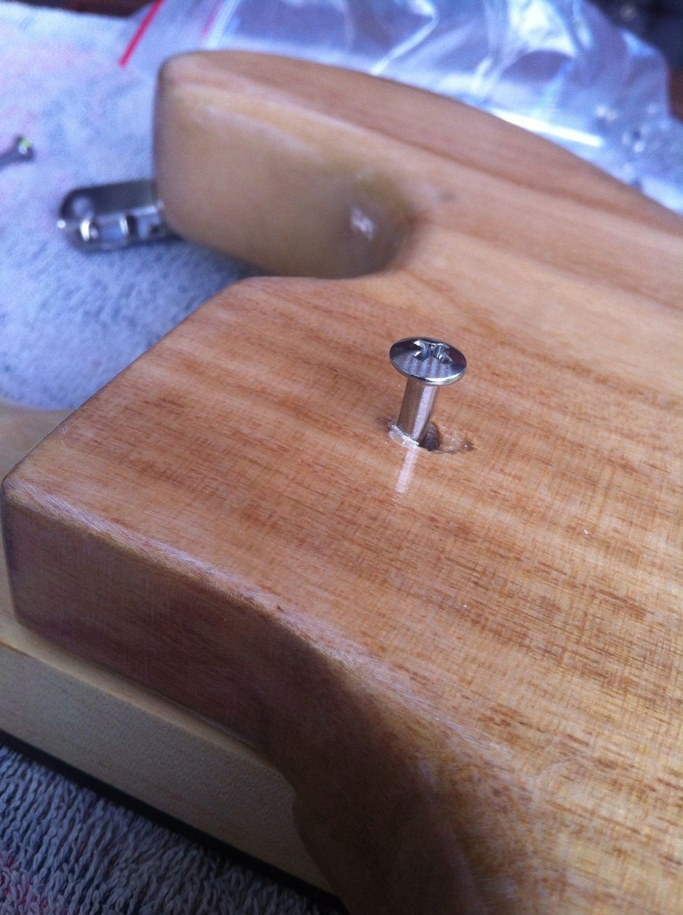 Take a long screw and drill in the hole. When you're done you have a plate you will drill over, I don't have any picture of that