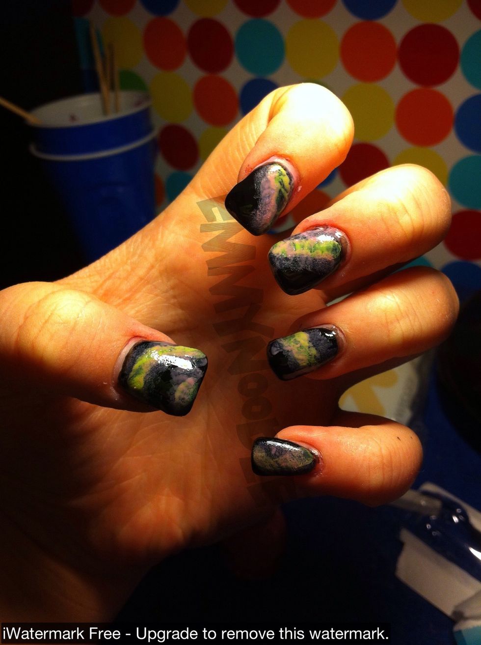 Take a makeup sponge and make nebulas on each finger using yellow, pink, and purple polish.