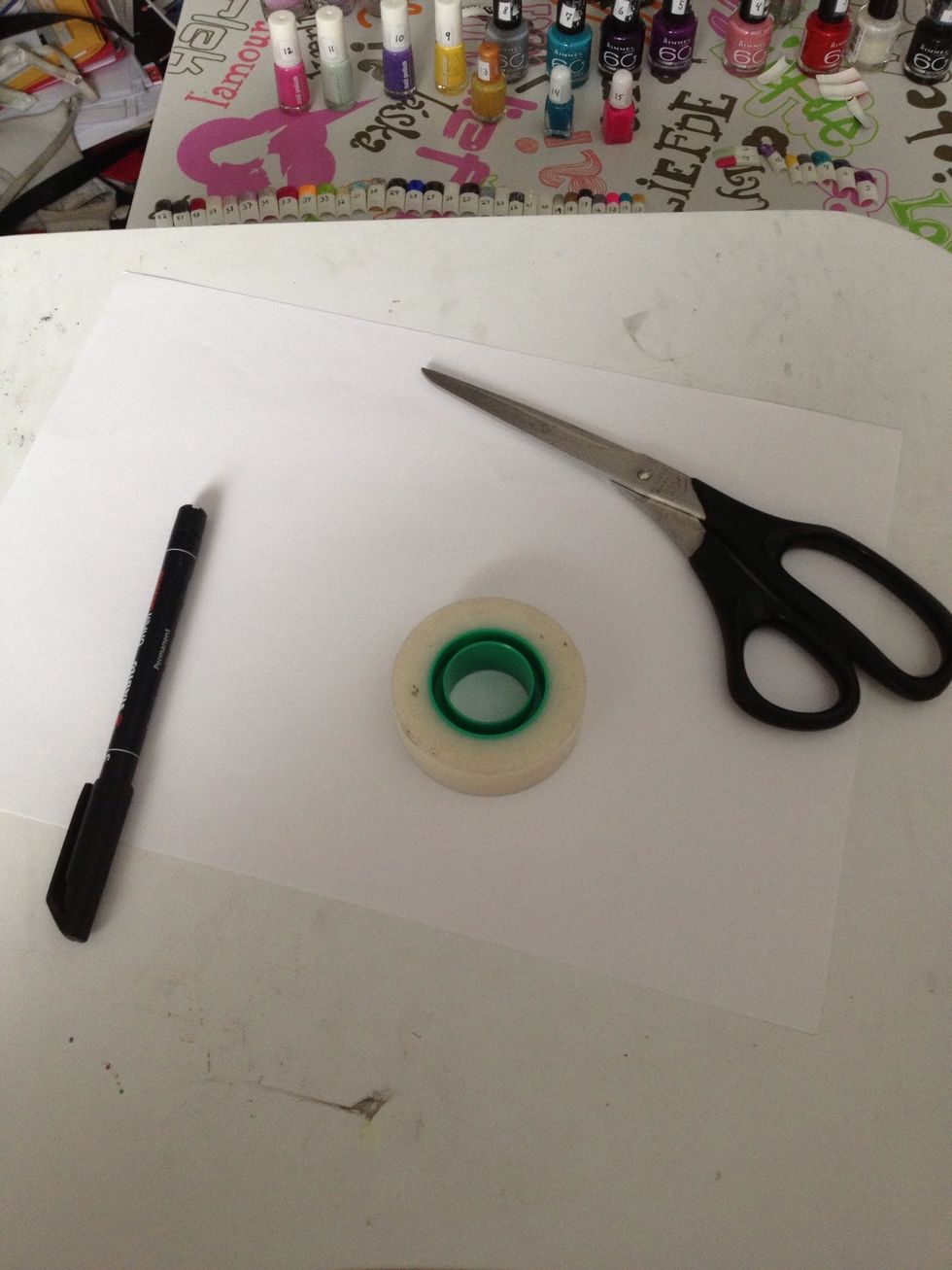 Take a marker, some paper, a scissors and some tape