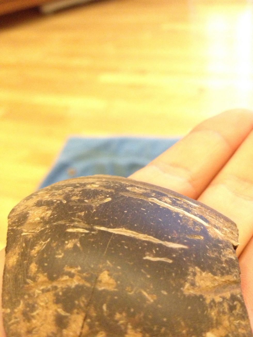 Take a medium - fine grit sandpaper and sand the front until it's smooth.