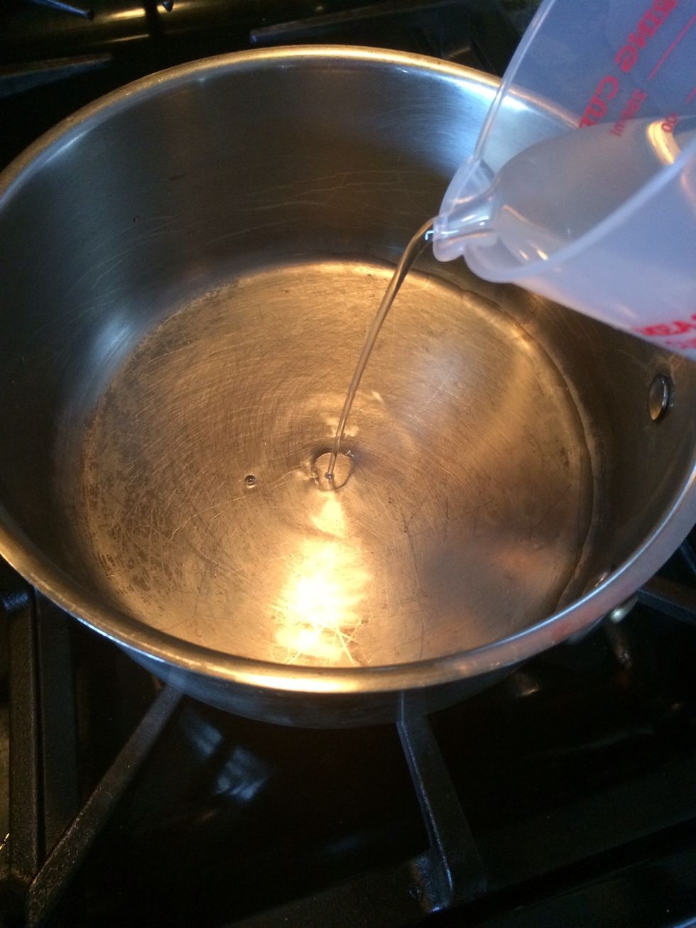 Take a medium size pot and pour the water in first