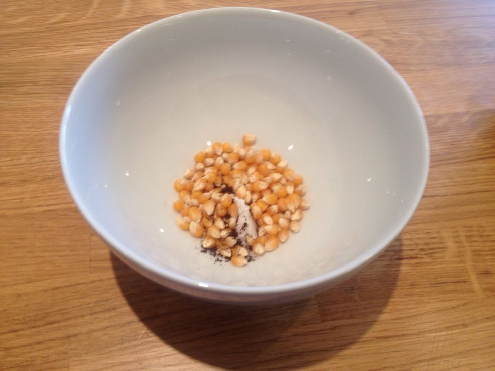 Take a microwaveable bowl or a pan and add 1 tbsp of popping corn, half a teaspoon of coconut oil and some vanilla extract (I use Ndali's vanilla powder)