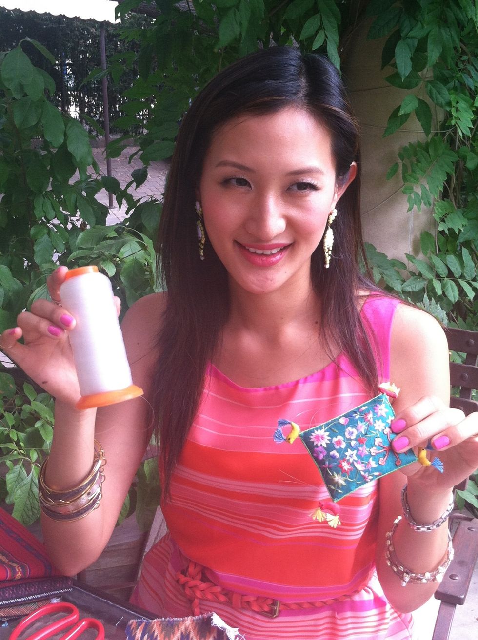 Take a needle and use clear fishline as thread