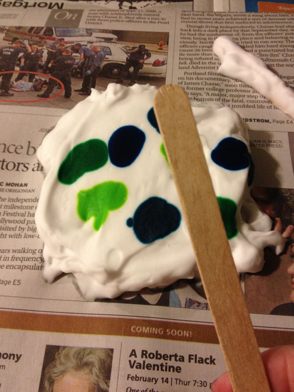 Take a new clean Popsicle stick and swirl around the food coloring and the cream\u2026