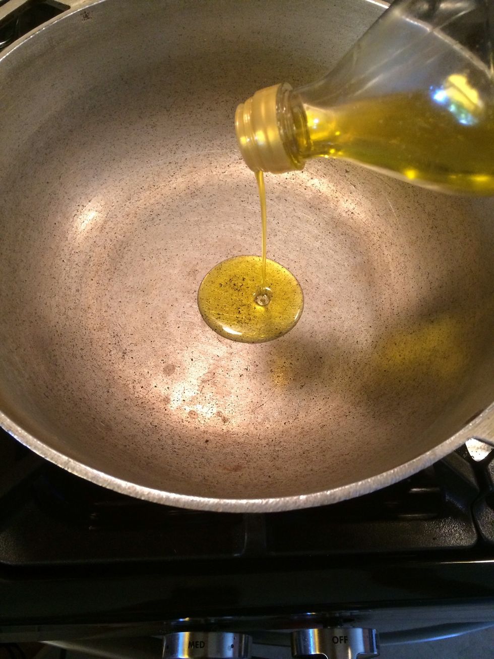 Take a nice heavy pot, set it over medium low heat and pour in about 2tbs of extra virgin olive oil