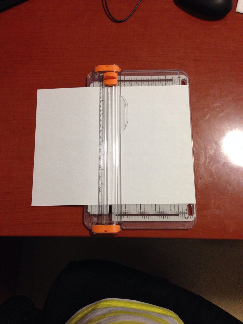 Take a paper cut and cut it in half.