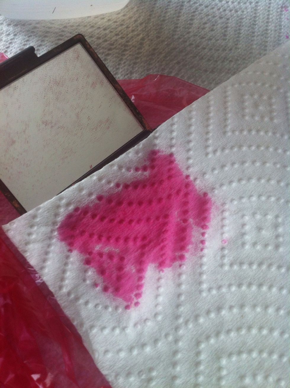 Take a paper towel and place it over the mixture and LIGHTLY press down so some of the alcohol can be absorbed.