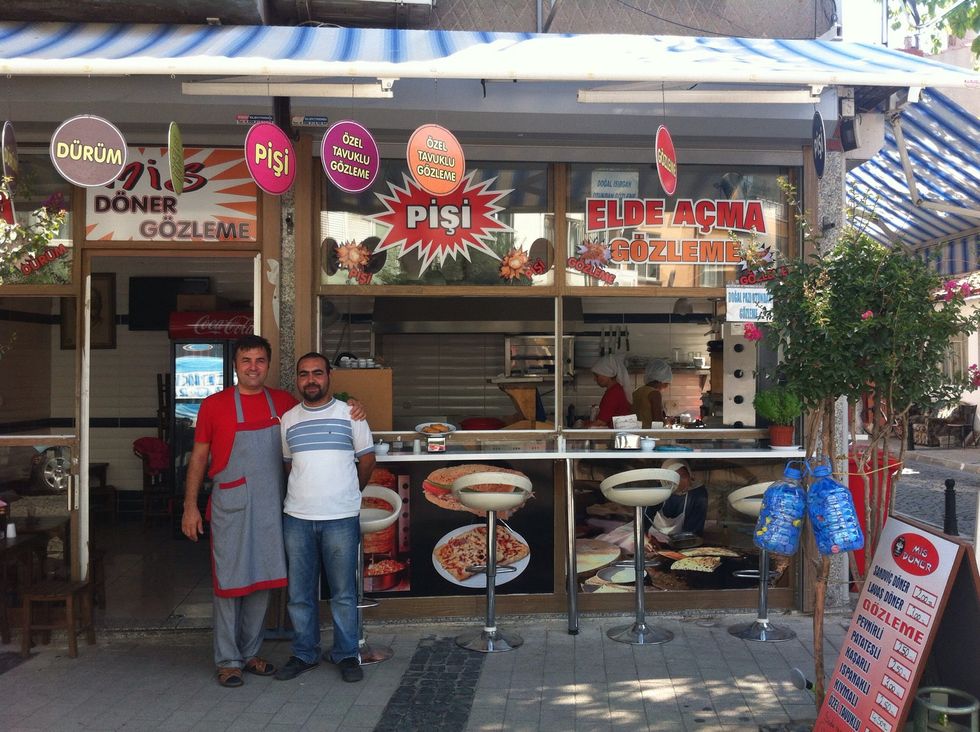 Take a photo of the boss in front of his shop. That will make him so happy and proud. Beautiful. Tell them to say "g\u00f6\u00f6\u00f6zleme" and capture their smiles.
