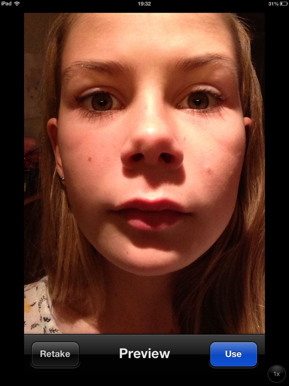 Take a picture like this. You are only going to see your eyes.