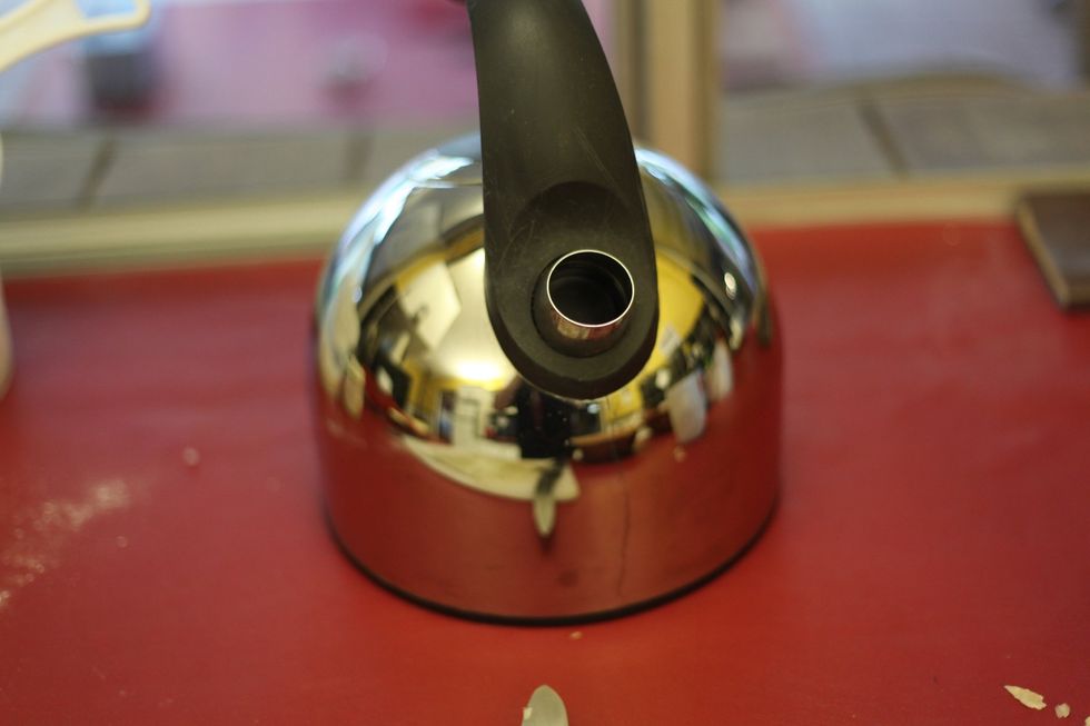 Take a picture of your kettle to pass the time. Boil hot water in that kettle. Here comes the safety tip. Don't burn yourself when pouring into the flour. Use a spoon to begin with ok.