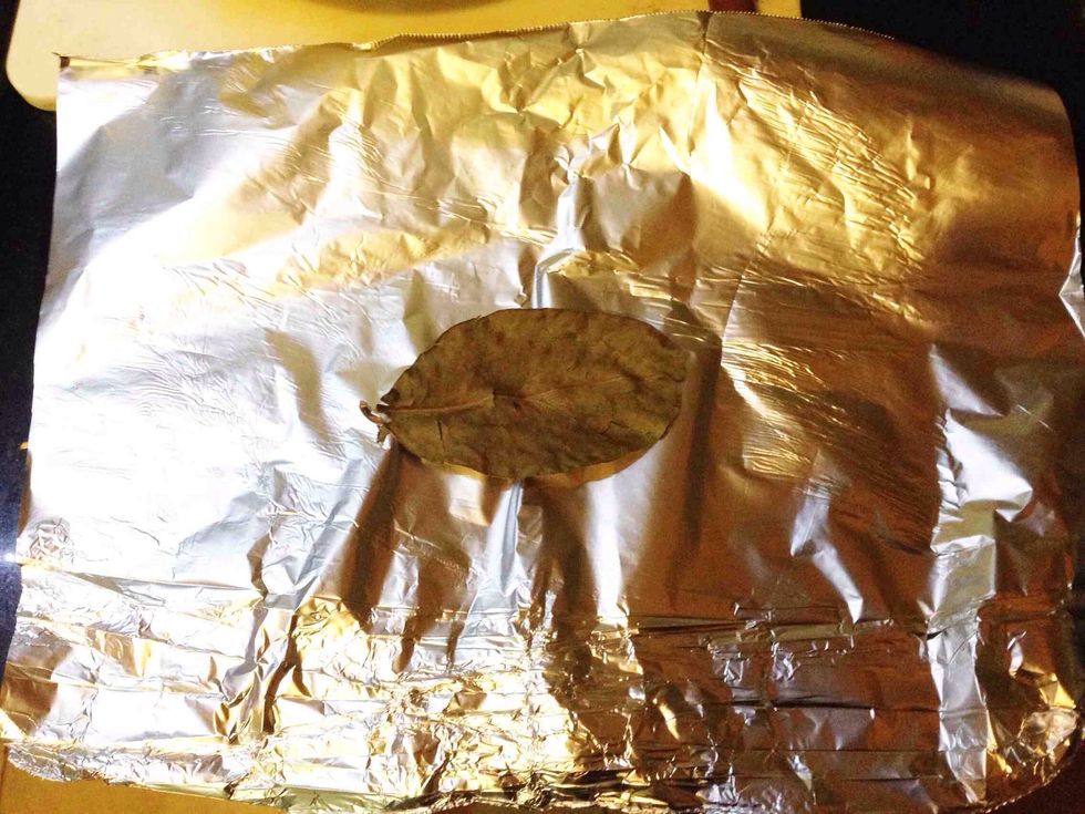 Take a piece of aluminium foil, place 1 dry bay leaf in the middle of the aluminium foil.