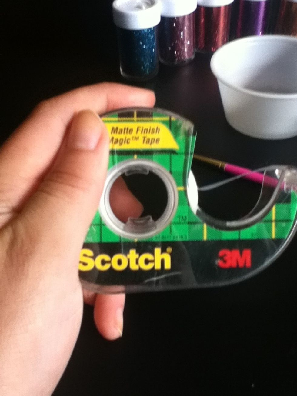 Take a piece of tape, not too long or you'll waste a lot of tape