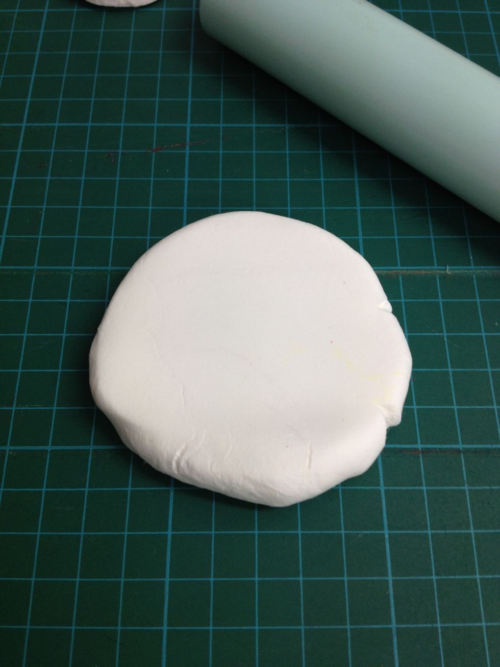 Take a piece of white clay and roll to flat.