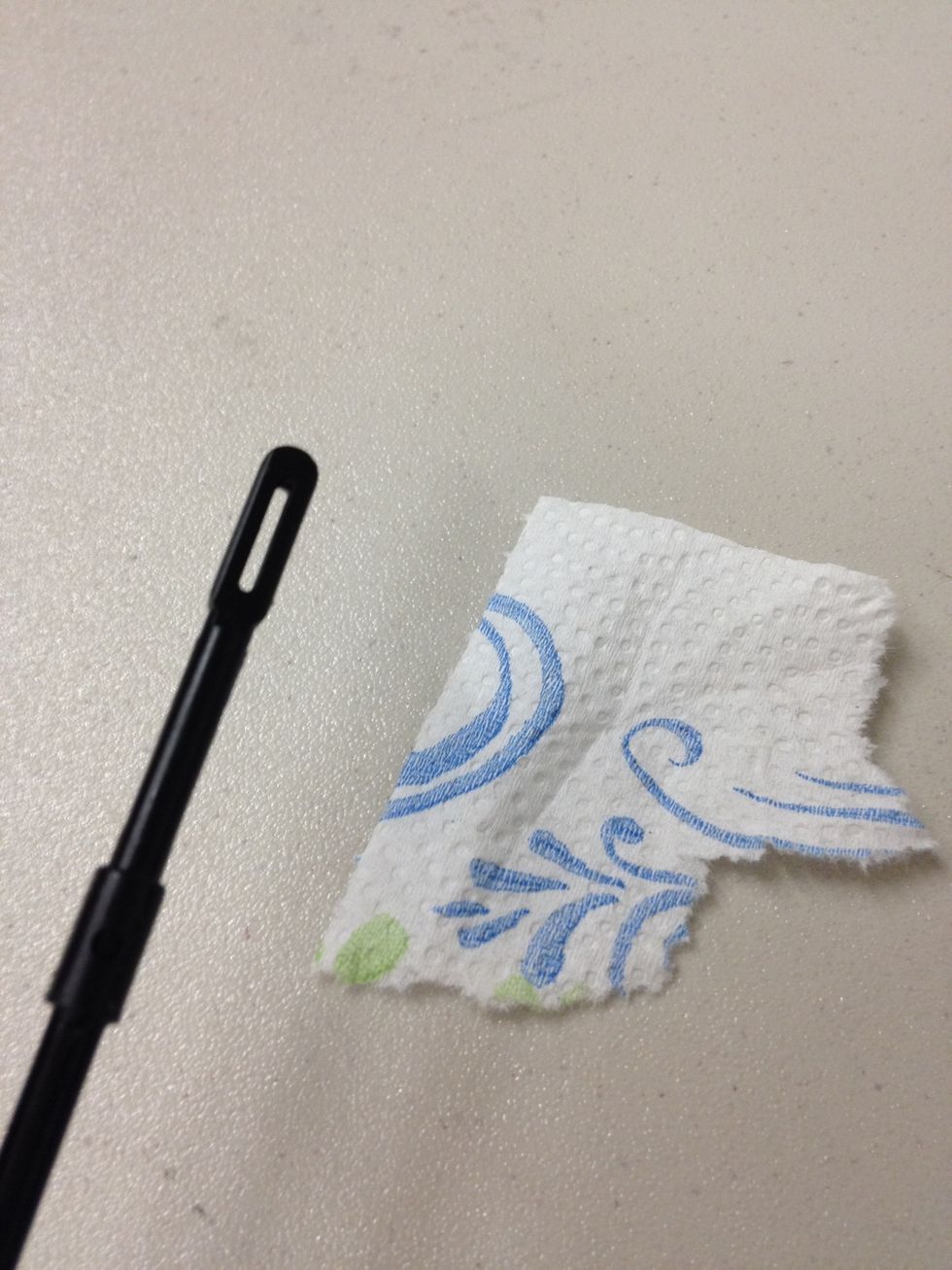 Take a pinch of a paper towel.