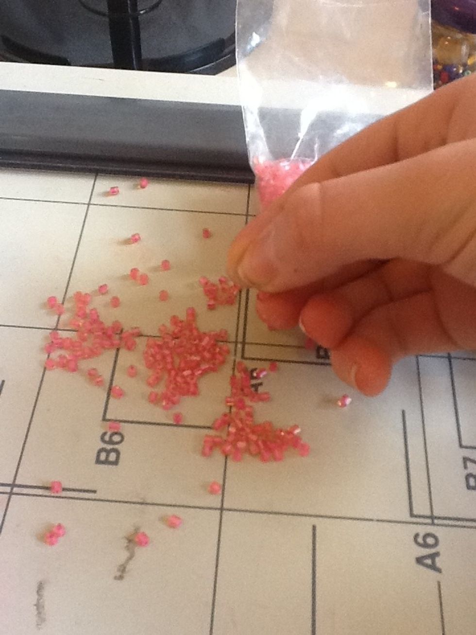 take a pinch of any small beads, you can get them in all craft stores