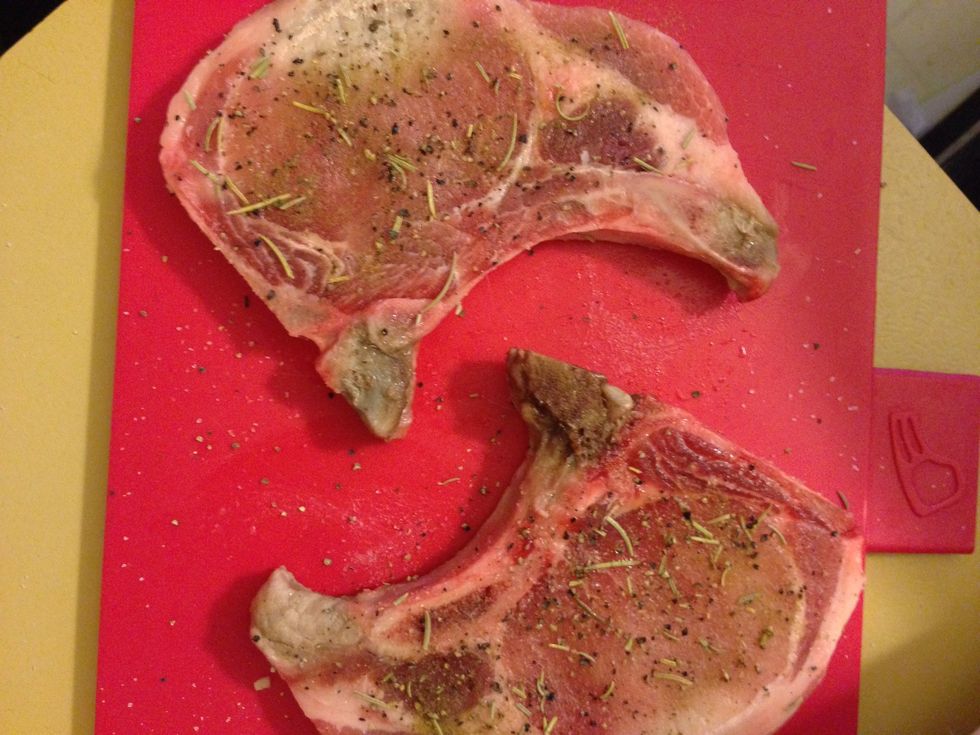 Take a pinch of the rosemary and break it up with your fingers as you sprinkle it on the chop. Do the same with thyme and rub it in on both sides.