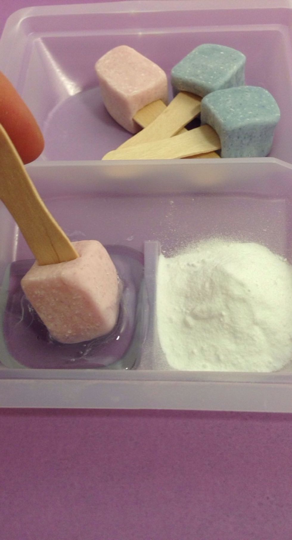 Take a Popsicle and Dip into and Roll around Gel Liquid on Left Side of Tray