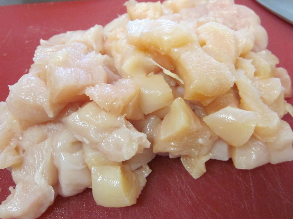 Take a pound of chicken and cube it.